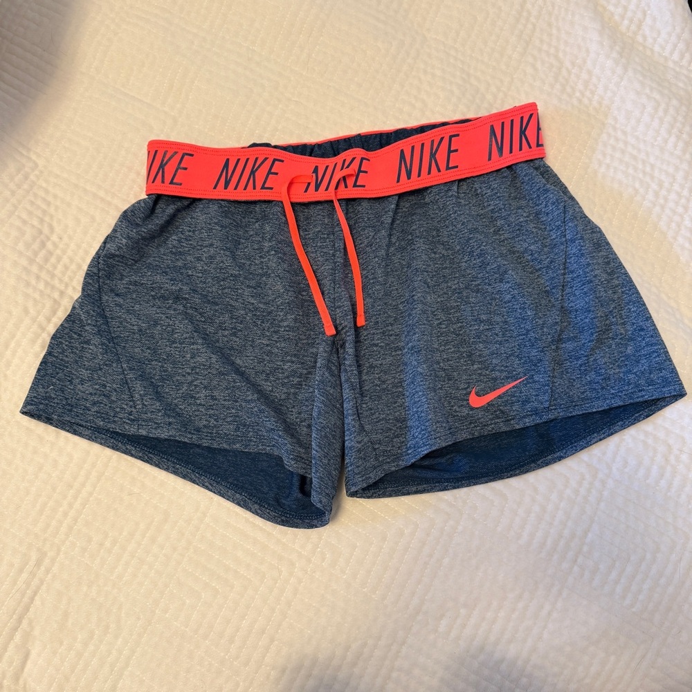 Women’s Nike Shorts Size Small, blue/denim color with pink accents